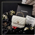 CHANEL Leather Top-Handle Bag with Embellished Handle